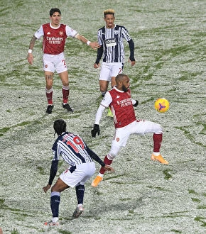 Images Dated 3rd January 2021: Arsenal's Lacazette Faces Off Against West Brom's Sawyers in Premier League Clash