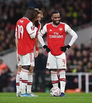 Arsenal's Lacazette, Luiz, and Pepe in Action against Leeds United in FA Cup Match