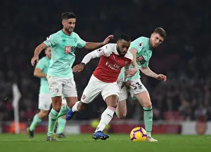 Arsenal V Bournemouth 2018-19 Prints: Arsenal's Lacazette Outmaneuvers Bournemouth's Surman and Mepham