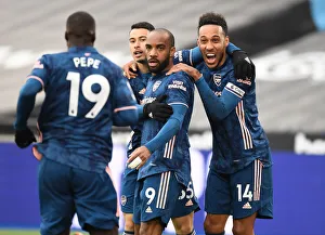 Arsenal's Lacazette, Pepe, Martinelli, and Aubameyang Celebrate Goals Against West Ham in Empty London Stadium