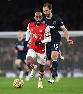 Arsenal V West Ham United 2021-22 Prints: Arsenal's Lacazette Scores Past West Ham's Dawson in Premier League Clash