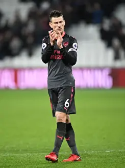 Arsenal's Laurent Koscielny Celebrates with Fans after West Ham Victory