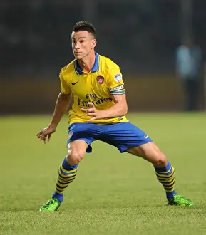 Indonesia Dream Team V Arsenal 2013-14 Prints: Arsenal's Laurent Koscielny Clashes with Indonesia All-Stars in 2013