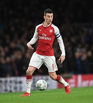 Images Dated 24th January 2018: Arsenal's Laurent Koscielny Focuses in Carabao Cup Semi-Final Clash Against Chelsea