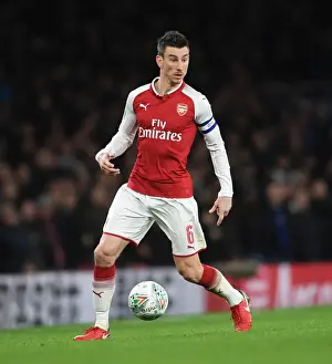 Arsenal V Chelsea - Carabao Cup 2017-18 Prints: Arsenal's Laurent Koscielny Focuses in Carabao Cup Semi-Final Clash Against Chelsea