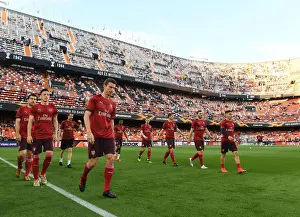 Arsenal's Laurent Koscielny Leads Pre-Match Warm-Up at Valencia's Estadio Mestalla (UEFA Europa League Semi-Final, Second Leg)