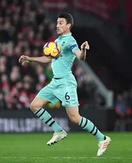 Liverpool V Arsenal 2018-19 Prints: Arsenal's Laurent Koscielny at Liverpool's Anfield during the 2018-19 Premier League Match