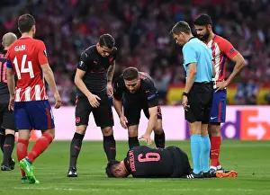 Atletico Madrid V Arsenal 2017-18 Prints: Arsenal's Laurent Koscielny Suffers Injury in UEFA Europa League Semi-Final vs Atletico Madrid