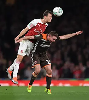Arsenal V Brentford - Carabao Cup 2018-19 Prints: Arsenal's Lichtsteiner Fends Off Judge in Carabao Cup Clash