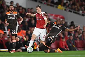Arsenal V Brentford - Carabao Cup 2018-19 Prints: Arsenal's Lichtsteiner vs. Mokotjo: Intense Carabao Cup Showdown