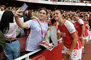 Arsenal's Lotte Wubben-Moy and Young Fan Share a Moment after Arsenal Women vs Liverpool Women Match at Emirates Stadium (2023-24)