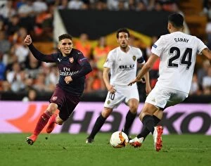 Images Dated 9th May 2019: Arsenal's Lucas Torreira Clashes with Valencia's Ezequiel Garay in UEFA Europa League Semi-Final