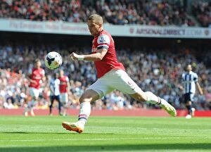 Arsenal v West Bromwich Albion 2013-14 Collection: Arsenal's Lukas Podolski in Action Against West Bromwich Albion (2013-14)