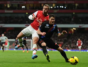 Arsenal V Crystal Palace 2013-14 Prints: Arsenal's Lukas Podolski Faces Off Against Crystal Palace's Joel Ward in Premier League Showdown