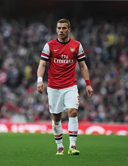 Arsenal's Lukas Podolski Fights for Possession Against Manchester City, Premier League 2013/14