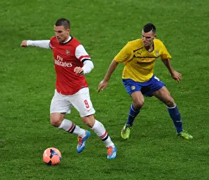 Arsenal V Coventry City - FA Cup 4th Rd 2013-14 Prints: Arsenal's Lukas Podolski Outruns Coventry's Conor Thomas in FA Cup Fourth Round Clash