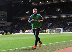Aston Villa v Arsenal 2013-14 Collection: Arsenal's Lukas Podolski Warming Up Ahead of Aston Villa Clash, 2014 Premier League