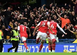 Arsenal's Magalhaes and Saka Celebrate Goal Against Chelsea in 2022-23 Premier League