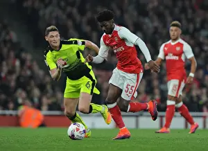 Arsenal V Reading EFL Cup 2016-17 Prints: Arsenal's Maitland-Niles Clashes with Reading's Evans in EFL Cup Showdown