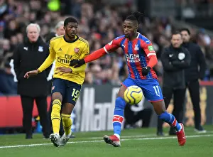 Arsenal's Maitland-Niles Faces Pressure from Zaha in Crystal Palace Clash (Premier League 2019-20)