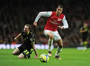 Arsenal V Leeds United FA Cup 2011-12 Prints: Arsenal's Marouane Chamakh Breaks Past Leeds Aidan White in FA Cup Clash