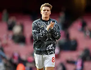 Arsenal's Martin Odegaard Acknowledges Fans in Warm-ups Before Arsenal v Brighton & Hove Albion, 2023-24