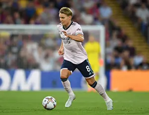 Arsenal's Martin Odegaard in Action: Battle Against Crystal Palace in 2022-23 Premier League