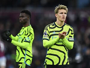 Images Dated 9th December 2023: Arsenal's Martin Odegaard Celebrates with Fans after Aston Villa Victory (2023-24)