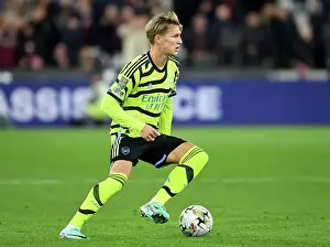 West Ham United V Arsenal - Carabao Cup 2023-24 Prints: Arsenal's Martin Odegaard in Control at London Stadium: West Ham United vs Arsenal
