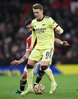 Manchester United v Arsenal 2020-21 Collection: Arsenal's Martin Odegaard Faces Off Against Manchester United at Old Trafford