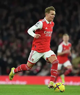 Manchester United F Prints: Arsenal's Martin Odegaard Faces Off Against Manchester United in Premier League Showdown (2022-23)