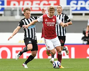 Newcastle United V Arsenal 2020-21 Prints: Arsenal's Martin Odegaard Faces Off Against Newcastle's Matt Ritchie in Empty St