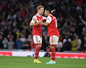 Arsenal's Martin Odegaard and Gabriel Martinelli in Action against Liverpool in the Premier League (2022-23)