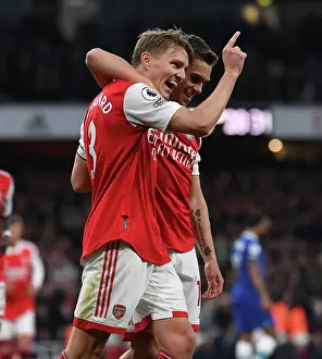 Arsenal's Martin Odegaard and Leandro Trossard Celebrate Goal Against Chelsea in 2022-23 Premier League