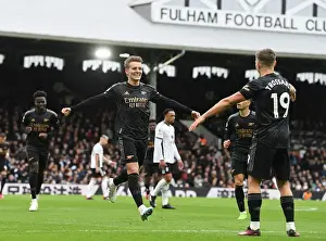 Arsenal's Martin Odegaard and Leandro Trossard Celebrate Their Strikes: A Triumphant Moment at Fulham (2022-23)
