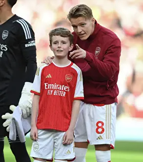 Arsenal's Martin Odegaard and the Mascot: United Before the Arsenal vs. Manchester City (2023-24) Match