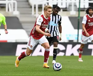 Arsenal's Martin Odegaard at Newcastle United: Premier League Clash Amidst Empty St. James Park (2020-21)