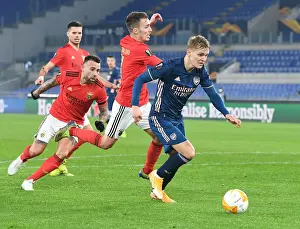 Arsenal's Martin Odegaard Outmaneuvers Benfica's Otamendi in Europa League Clash