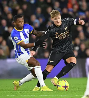 Arsenal's Martin Odegaard Outmaneuvers Brighton's Pervis Estupinan in Premier League Clash