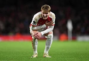 Images Dated 29th December 2023: Arsenal's Martin Odegaard Reacts to Injury During Arsenal v West Ham United (2023-24)