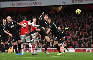 Arsenal V Brighton And Hove Albion 2019-20 Prints: Arsenal's Martinelli Battles Past Brighton's Dunk in Premier League Clash