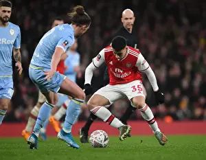 Arsenal's Martinelli Clashes with Leeds Ayling in FA Cup Showdown