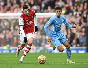 Arsenal's Martinelli Clashes with Manchester City's Cancelo in Premier League Showdown
