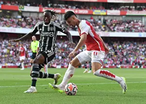 Arsenal V Manchester United 2023-24 Prints: Arsenal's Martinelli Clashes with Manchester United's Wan-Bissaka in 2023-24 Premier League Showdown
