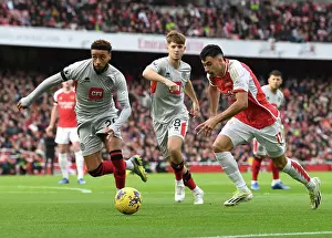 Arsenal's Martinelli Clashes with Sheffield United's Bogle: Premier League Showdown at Emirates Stadium (2023-24)