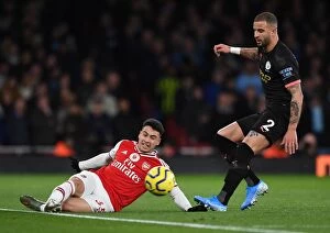Images Dated 16th December 2019: Arsenal's Martinelli Faces Off Against Manchester City's Walker in Premier League Showdown