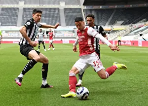 Arsenal's Martinelli Faces Off Against Newcastle's Fernandez in Empty St. James Park