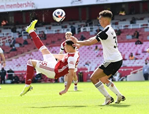 Images Dated 18th April 2021: Arsenal's Martinelli Goes for Bicycle Kick Against Fulham in Empty Emirates Stadium