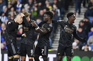 Arsenal's Martinelli, Odegaard, Saka, and Nketiah: Celebrating a Win Against Brighton