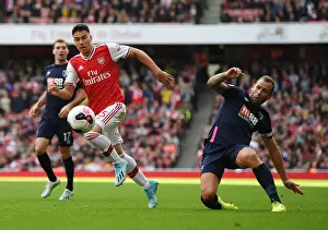 Arsenal's Martinelli Outmaneuvers Bournemouth's Cook in Premier League Clash